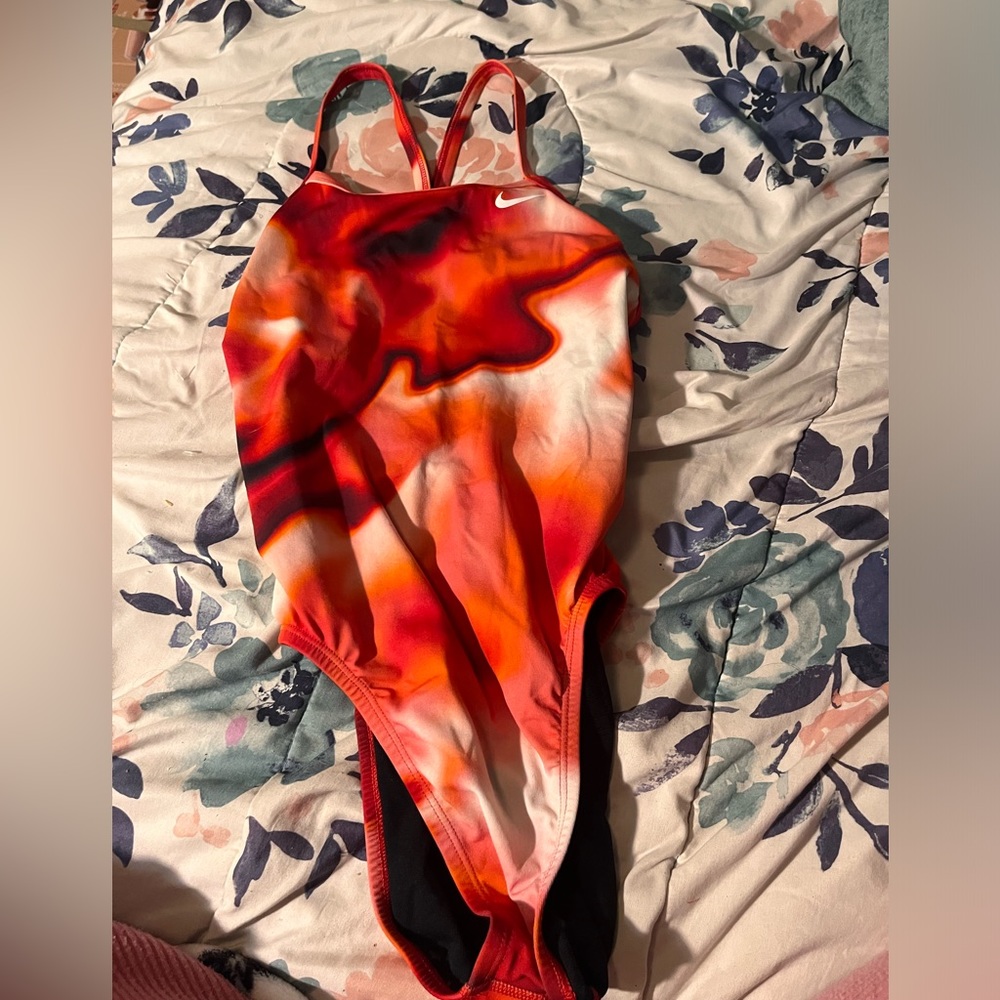 Red, white, orange, and black Nike swim suit